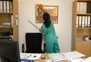 A cleaner working in an office